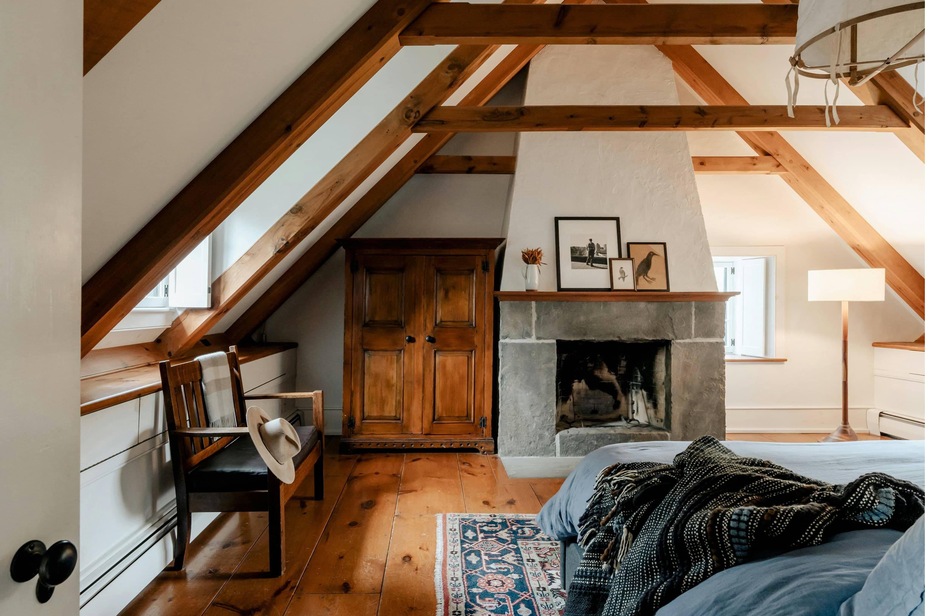 Attic bedroom with sloped ceiling and exposed roof timbers